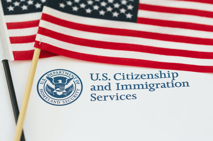 American Flag with U.S. Citizenship Immigration paper