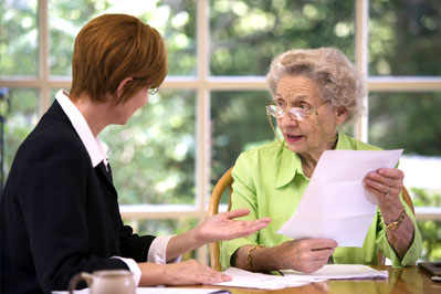 Senior woman meeting with estate planning agent