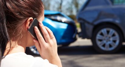 Woman calling insurance company after wreck