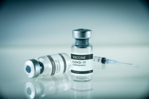 Covid-19 vaccine bottle and syringe