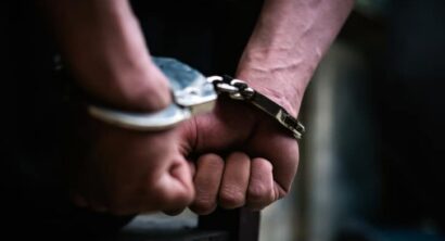 Man on the chair in handcuffs