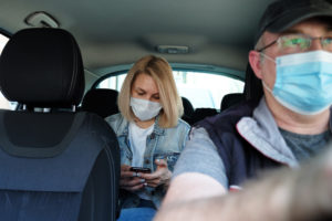 Person in back seat of Uber of Lyft