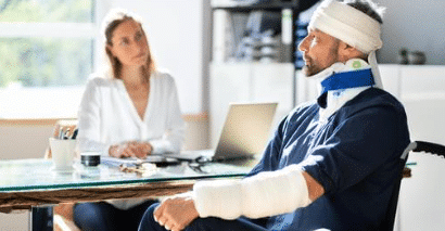 Worker with injuries consulting an attorney about a work-related claim