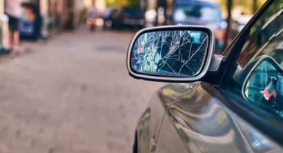 Car with broken side door mirror