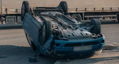 Road traffic accident. Overturned car on the highway.