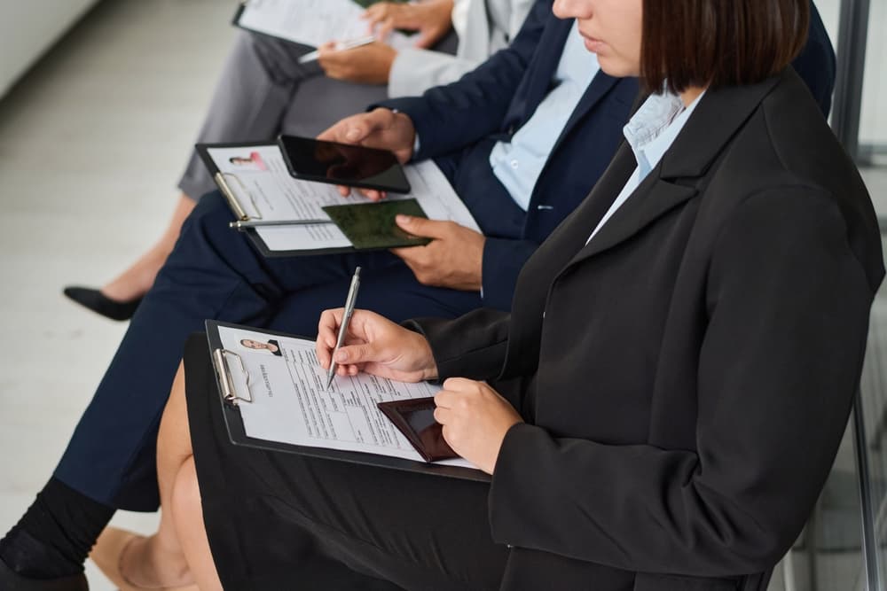 People filling documents to get visa