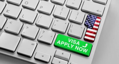 Computer keyboard with u.s flag and apply now for visa button