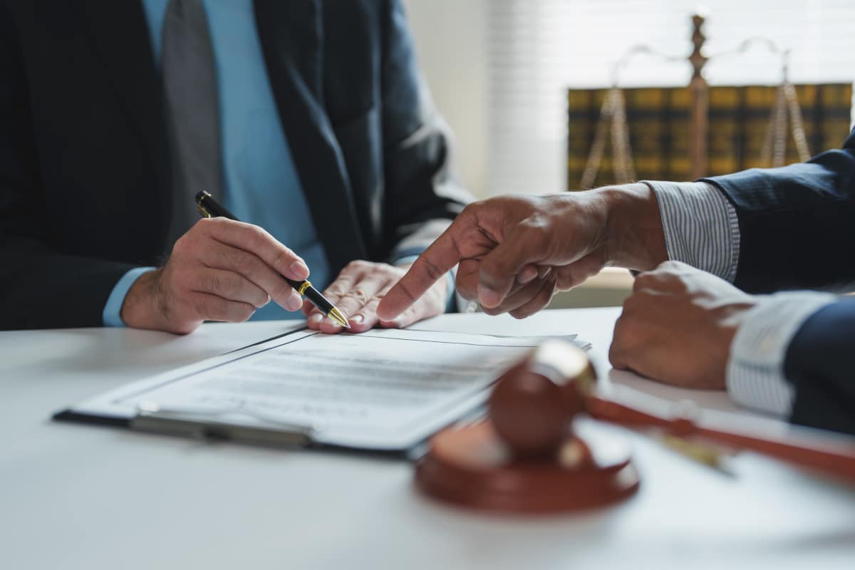 Avoiding Probate in Texas: Legal Strategies Every DFW Family Should Consider. Legal professionals reviewing contract terms, ensuring compliance and agreement before signing.