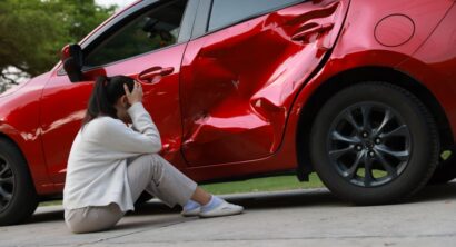 Roadside Emergency: Female Driver Involved in Car Accident, Calling for Insurance Assistance. Asian female driver Young woman calling for roadside assistance or an insurance company