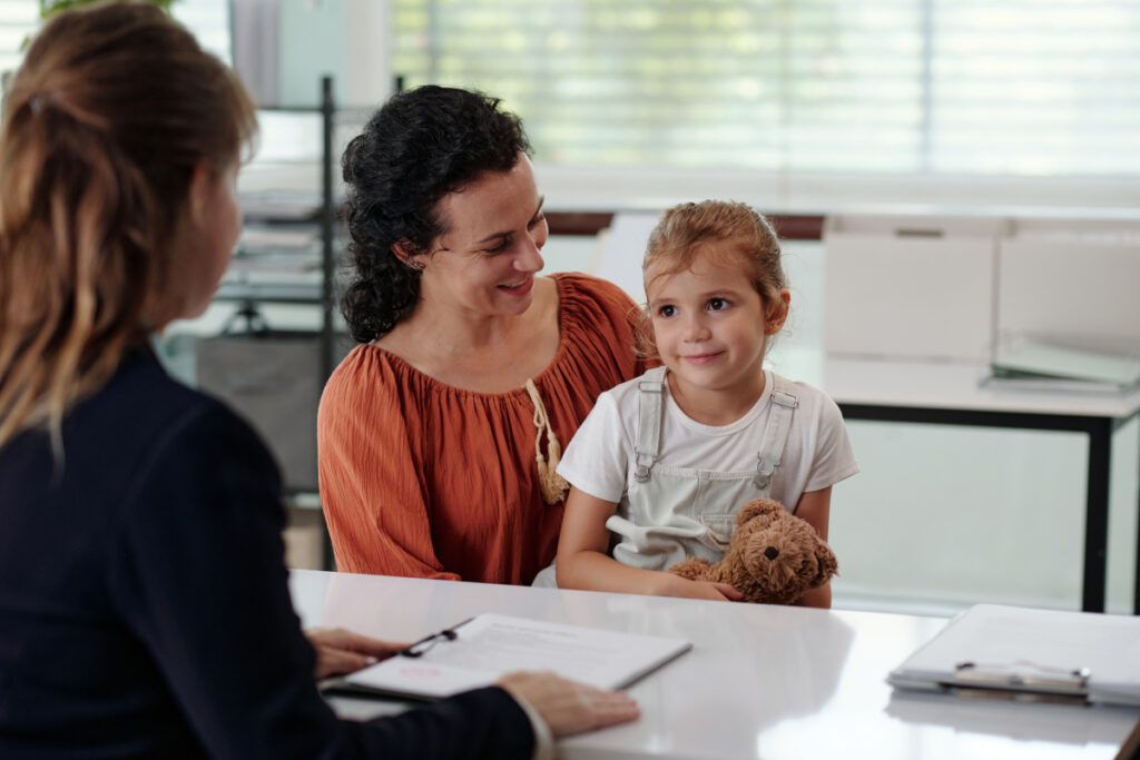Woman With Child Visiting To Social Worker