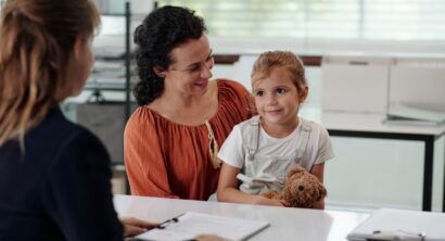 Woman With Child Visiting To Social Worker