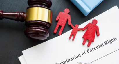 Documents about Termination of parental rights and family figurines.
