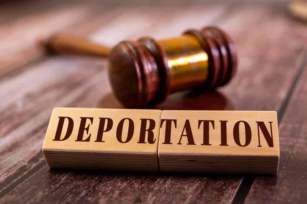 Two wooden blocks with the word "DEPORTATION"