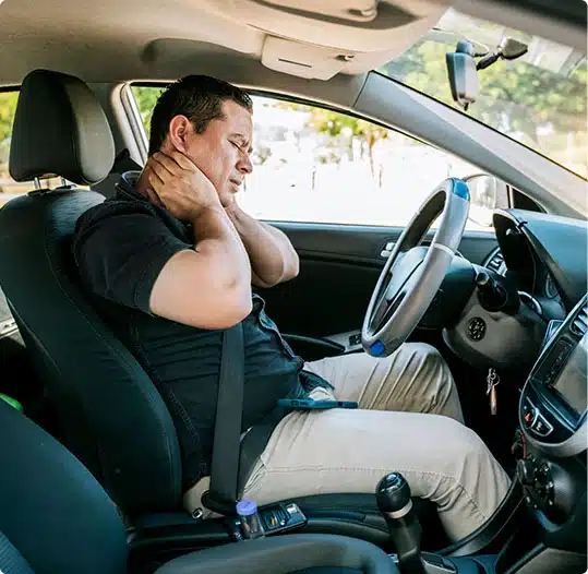 male driver with neck pain