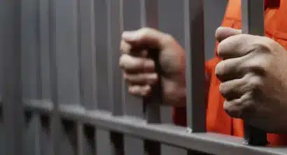 prisoner behind bars